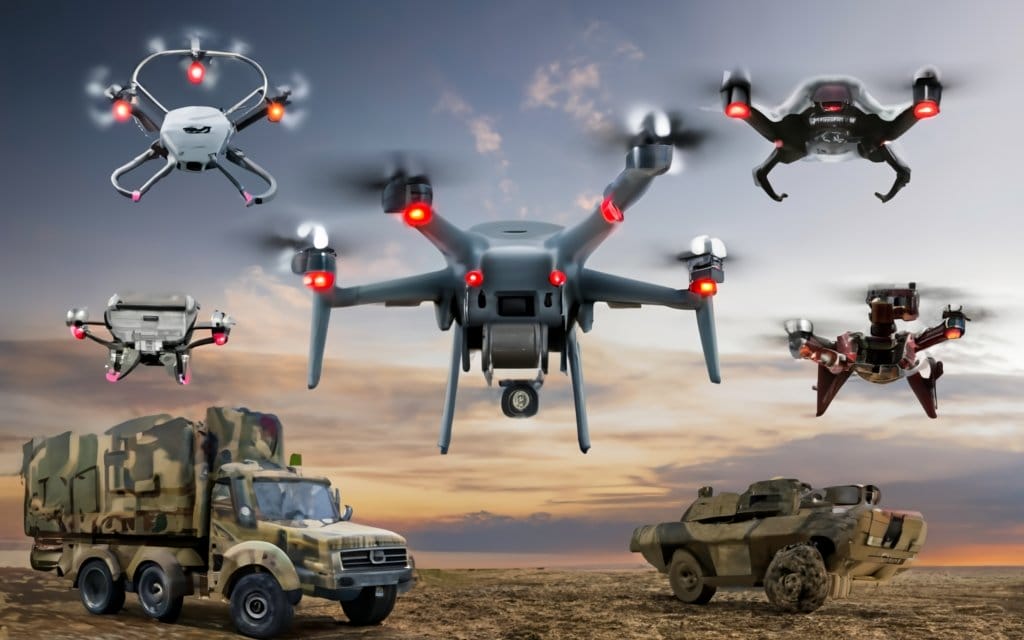Drone technology and military vehicles in action, showcasing advanced drone and warfare capabilities.